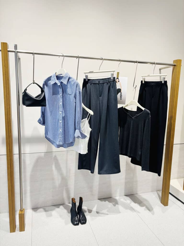 A corner of ShinAnHi garment showroom displaying apparel samples